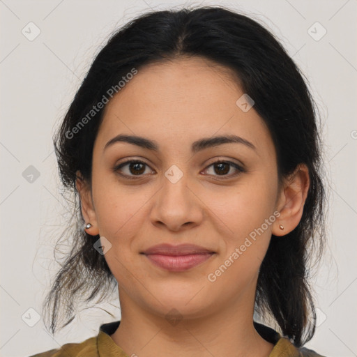 Joyful latino young-adult female with medium  brown hair and brown eyes