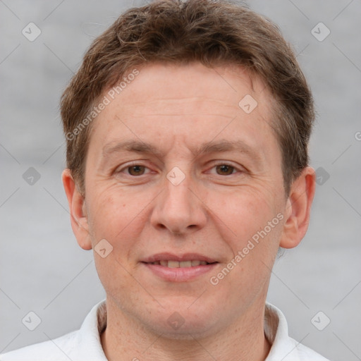 Joyful white adult male with short  brown hair and grey eyes