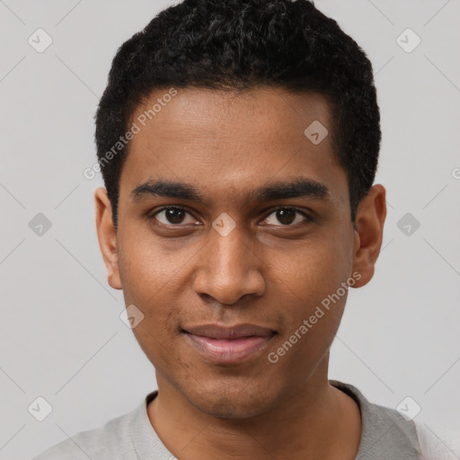 Joyful black young-adult male with short  black hair and brown eyes