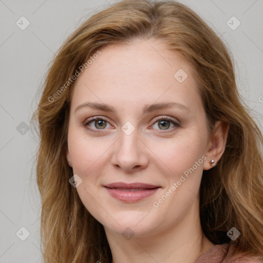 Joyful white young-adult female with long  brown hair and blue eyes