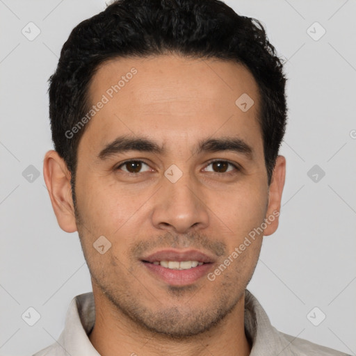 Joyful white young-adult male with short  black hair and brown eyes