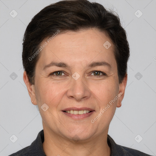 Joyful white adult female with short  brown hair and brown eyes