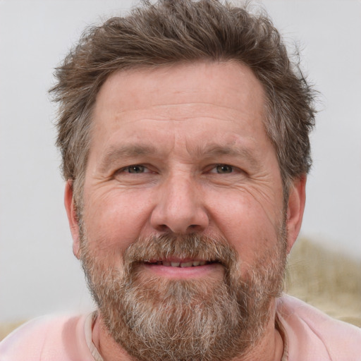 Joyful white middle-aged male with short  brown hair and grey eyes