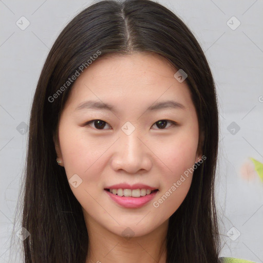 Joyful asian young-adult female with long  brown hair and brown eyes