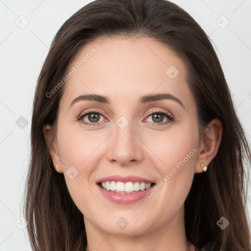 Joyful white young-adult female with long  brown hair and grey eyes