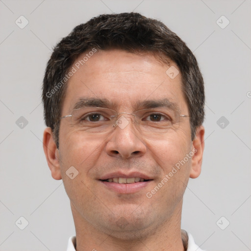 Joyful white adult male with short  brown hair and brown eyes