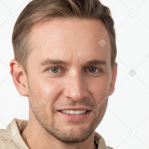 Joyful white young-adult male with short  brown hair and grey eyes