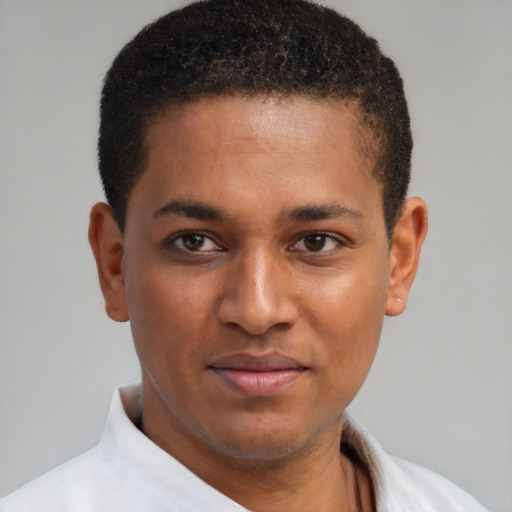 Joyful latino young-adult male with short  brown hair and brown eyes