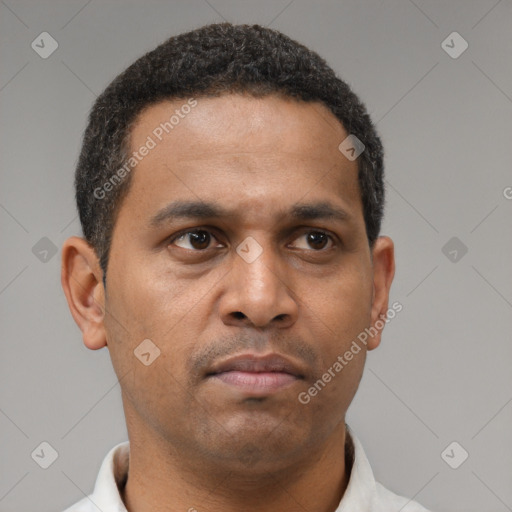 Neutral latino young-adult male with short  brown hair and brown eyes
