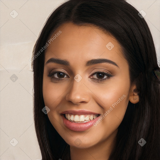 Joyful latino young-adult female with long  black hair and brown eyes