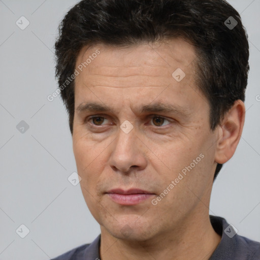 Neutral white adult male with short  brown hair and brown eyes