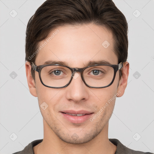 Joyful white young-adult male with short  brown hair and grey eyes