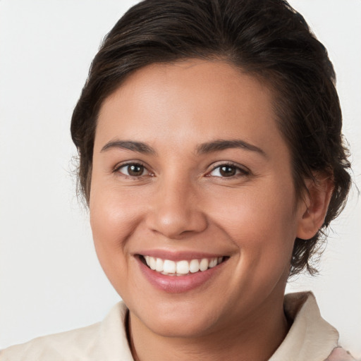 Joyful white young-adult female with medium  brown hair and brown eyes