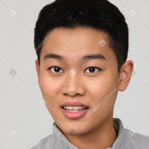 Joyful asian young-adult male with short  black hair and brown eyes