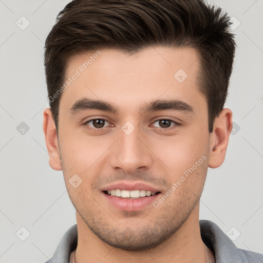 Joyful white young-adult male with short  brown hair and brown eyes