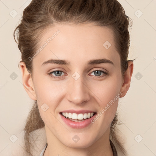 Joyful white young-adult female with long  brown hair and grey eyes