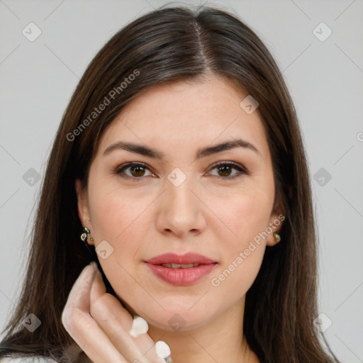 Joyful white young-adult female with long  brown hair and brown eyes