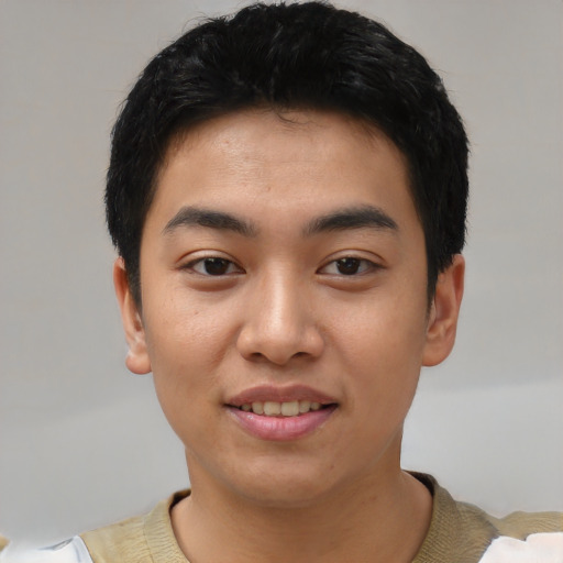 Joyful asian young-adult male with short  black hair and brown eyes