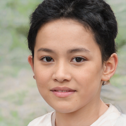 Joyful white child female with short  brown hair and brown eyes