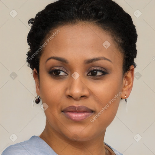 Joyful black young-adult female with short  brown hair and brown eyes