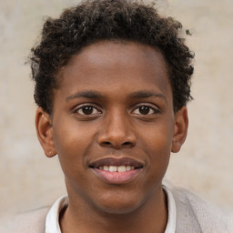 Joyful black young-adult male with short  brown hair and brown eyes