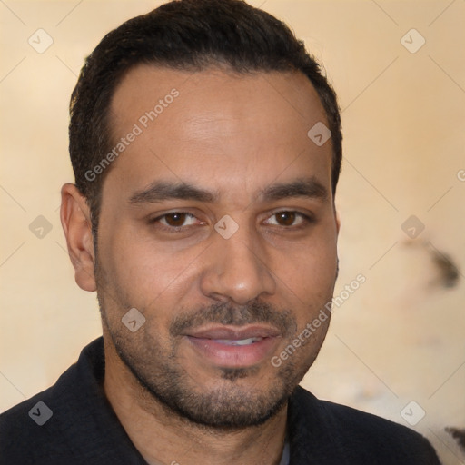 Joyful white young-adult male with short  black hair and brown eyes
