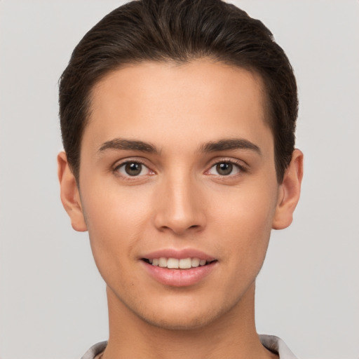 Joyful white young-adult male with short  brown hair and brown eyes