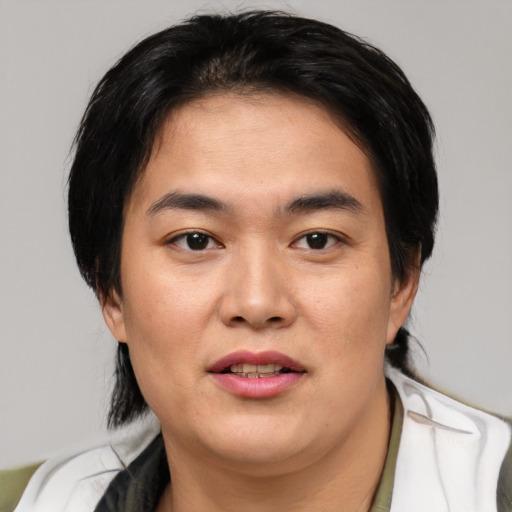 Joyful white young-adult male with medium  brown hair and brown eyes