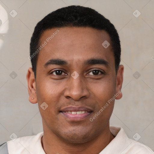 Joyful latino young-adult male with short  brown hair and brown eyes