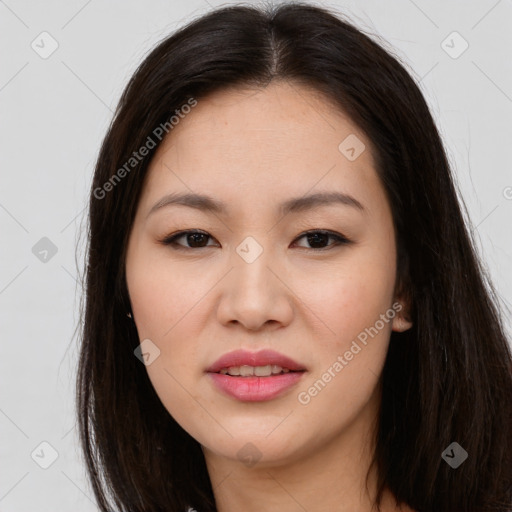 Joyful asian young-adult female with long  brown hair and brown eyes