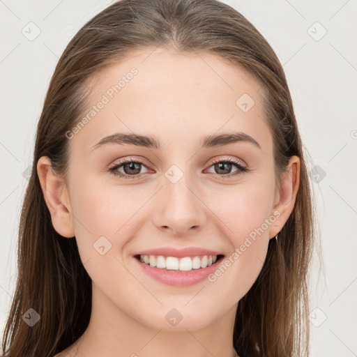 Joyful white young-adult female with long  brown hair and grey eyes