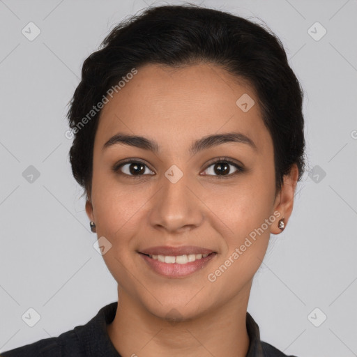 Joyful latino young-adult female with short  brown hair and brown eyes