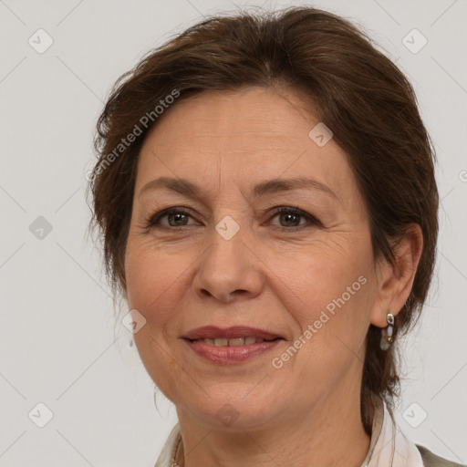 Joyful white adult female with medium  brown hair and brown eyes