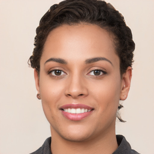 Joyful white young-adult female with short  brown hair and brown eyes