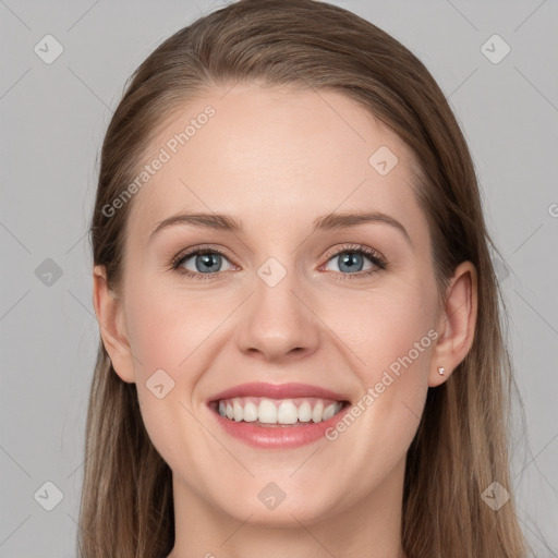 Joyful white young-adult female with long  brown hair and grey eyes