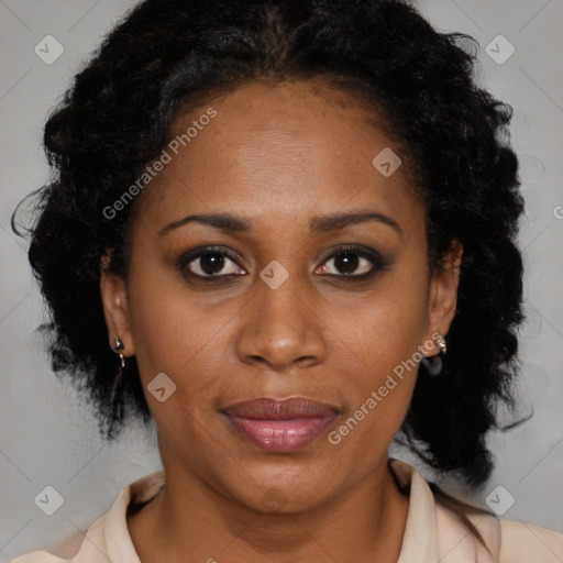 Joyful black adult female with medium  brown hair and brown eyes