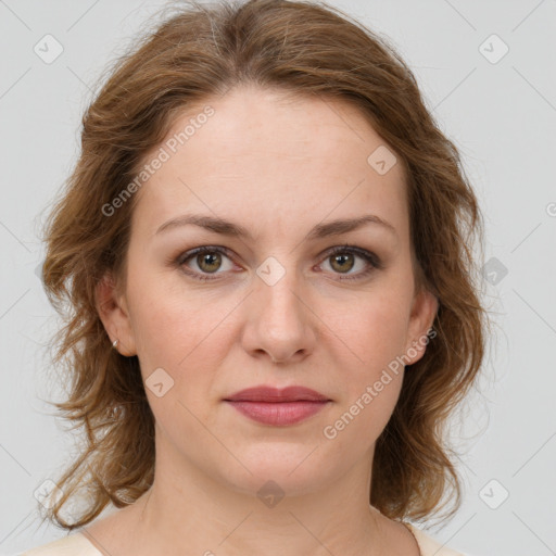 Joyful white young-adult female with medium  brown hair and green eyes