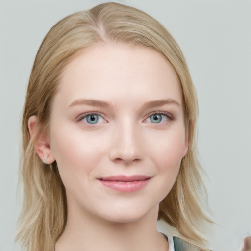 Joyful white young-adult female with medium  brown hair and blue eyes