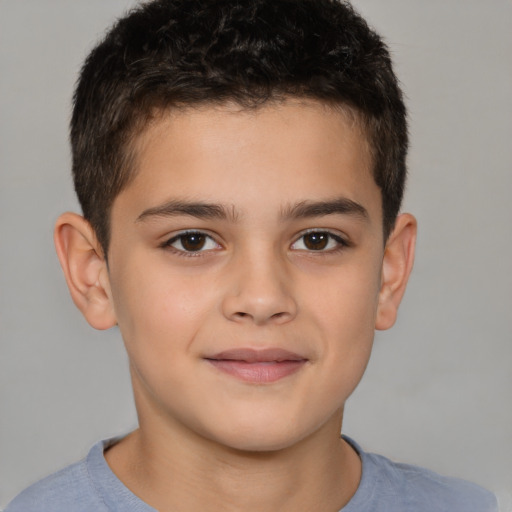 Joyful white child male with short  brown hair and brown eyes