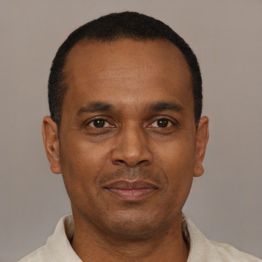 Neutral latino adult male with short  black hair and brown eyes