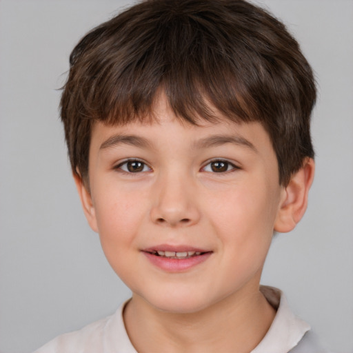 Joyful white child male with short  brown hair and brown eyes