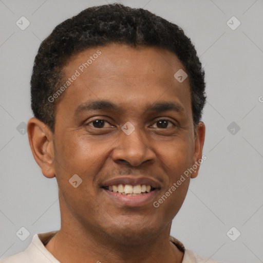 Joyful latino young-adult male with short  brown hair and brown eyes