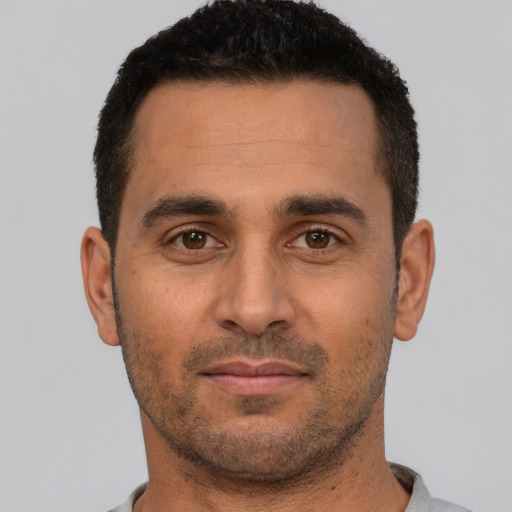 Neutral white young-adult male with short  black hair and brown eyes