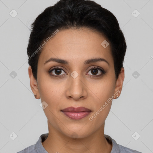 Joyful latino young-adult female with short  black hair and brown eyes