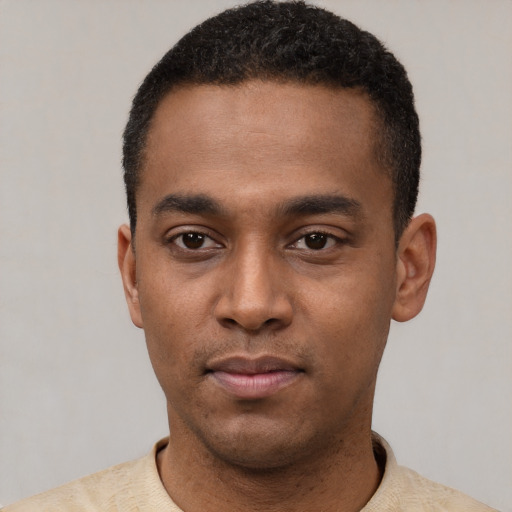 Neutral latino young-adult male with short  black hair and brown eyes