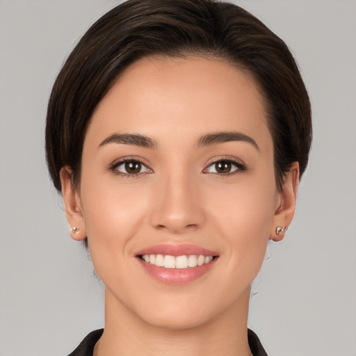 Joyful white young-adult female with medium  brown hair and brown eyes