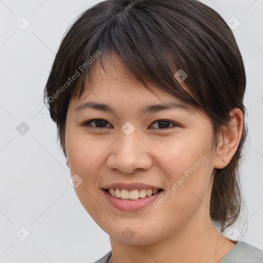 Joyful white young-adult female with medium  brown hair and brown eyes