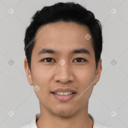 Joyful asian young-adult male with short  black hair and brown eyes