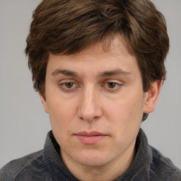 Neutral white adult male with short  brown hair and grey eyes