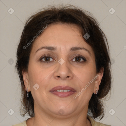 Joyful white adult female with medium  brown hair and brown eyes